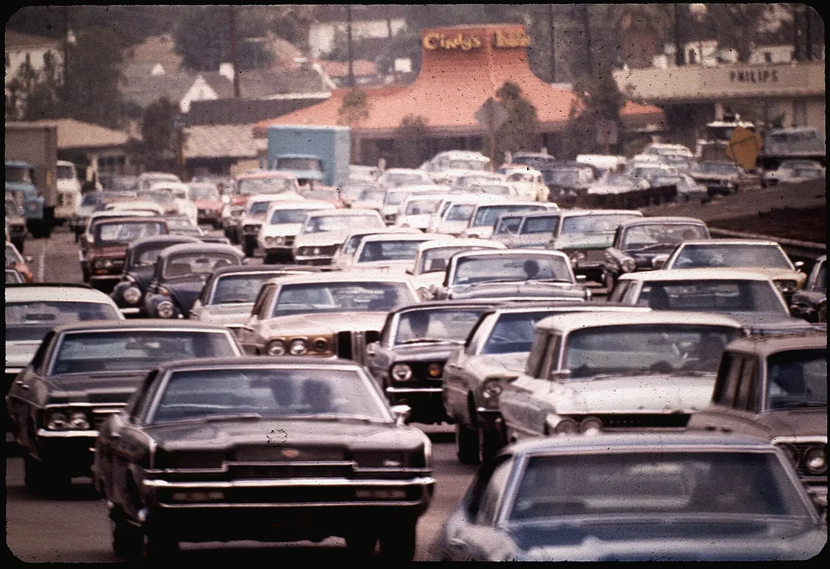 An older photograph of heavy, slow traffic filling a Los Angeles freeway